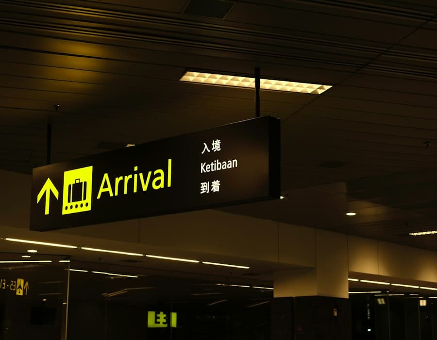 An arrivals sign glowing in an airport terminal